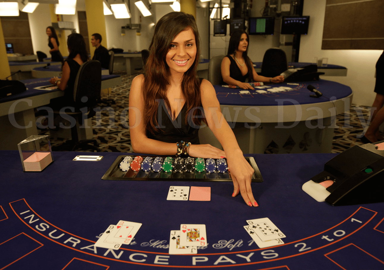 Blackjack dealer pointing a hand on the table