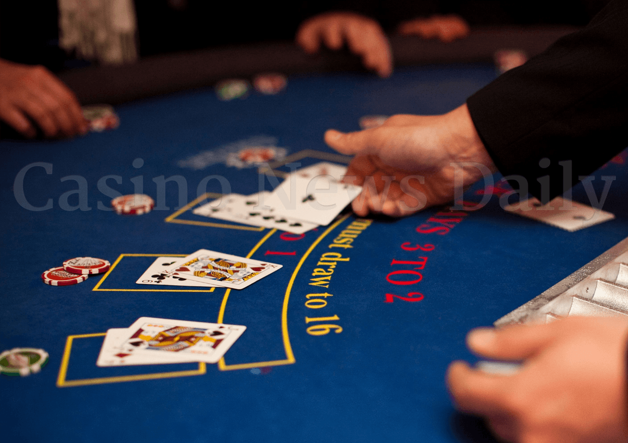 Blackjack dealer dealing cards.