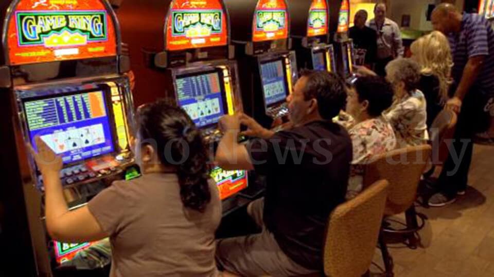 People Playing Video Poker Tournament